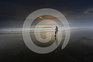 A man walking at a beach