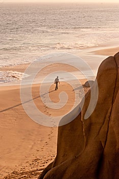 Man walking on beach alone