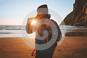 Man walking on beach enjoying sunset ocean view travel vacations