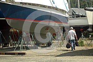 Man walking in boatyard photo