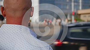 Man walking through the Crowd of People in the Big City. Crossing the street. Close up shot.