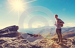 Man walking on the edge of a cliff