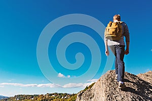 Man walking on the edge of a cliff