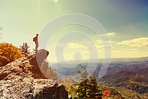 Man walking on the edge of a cliff