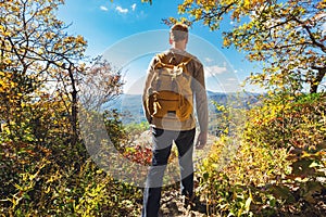 Man walking on the edge of a cliff