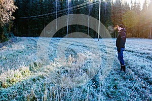 Man walking on frozen field