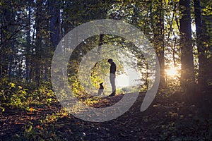 Man walking his dog in the woods