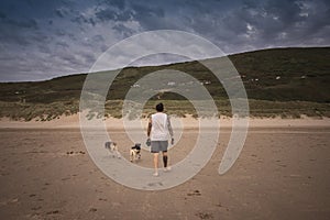 Man walking his dogs in Woolacombe