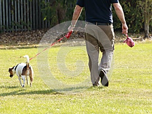 Man walking his pet dog