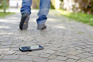 Man walking after losing his smart-phone