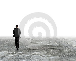 Man walking in mist on dirty concrete floor