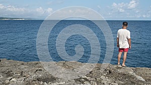 Man Walking Near Sea