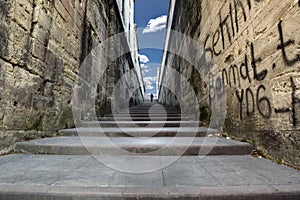 A man walking right up the long stairs