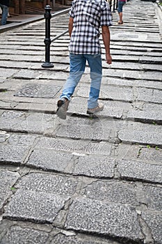 Man walking the rocky steps
