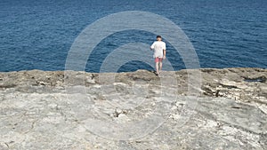 Man Walking By Sea