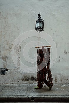 man walking with a set of hanging doorway bead curtain at the heart of the historical city