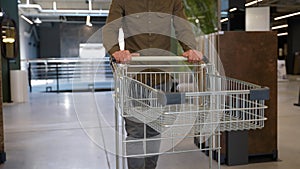 A man walking with shopping cart at luxury tiles shop