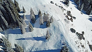 A man is walking on a snowy slope.