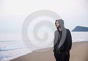 Man walking in solitude at the beach