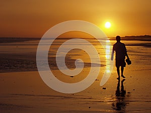 Man walking at sunset