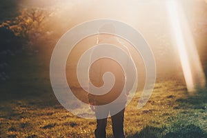 Man walking at sunset light forest Travel Lifestyle