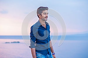 Man walking thoughtful blue sky and sea on background