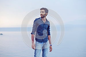 Man walking thoughtful blue sky and sea on background