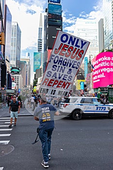 Man in Times Square with a Religious Sign Proclaiming the End is Near in New York City