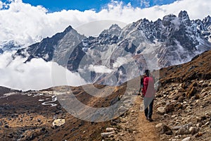 A man walking to Lumde village after cross Renjo la pass, Everest region in Himalaya mountains, Nepal