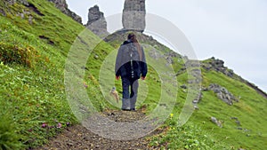 Man walking to the Old man of Storr