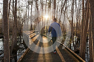 Man walking trail in early morning