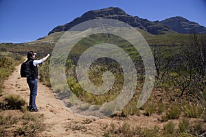 Man walking up a mountain