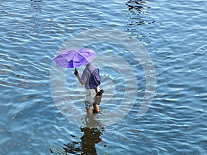 Man walking through the water