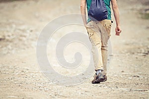 Man walking by way in the mountains