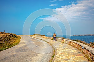 A man walks along the promenade photo