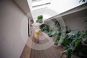 Man walks down the hotel corridor