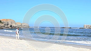 Man walks by the seaside