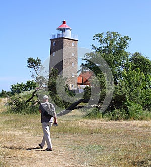 Man walks to the lighthouse