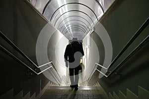 Man walks in the underpass