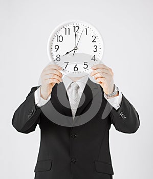 Man with wall clock