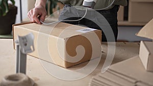 A man warehouse worker online store owner preparing parcel boxes checking e commerce shipping online retail e commerce