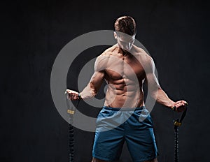 A man warms up with the latex resistance band.