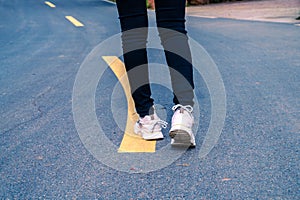 A man was walking on an outdoor road