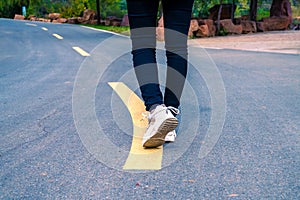 A man was walking on an outdoor road