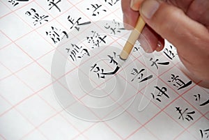 A man was writing Chinese calligraphy