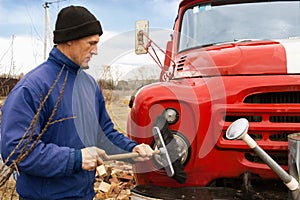 A man washes the old fire truck