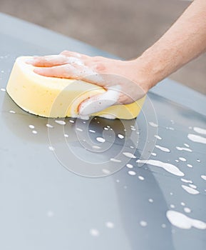 Man washing a car