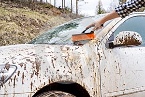 Man washing dirty car photo