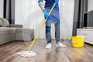 Man washing floor in the apartment