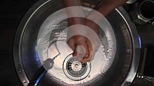 Man washing hands in a sink